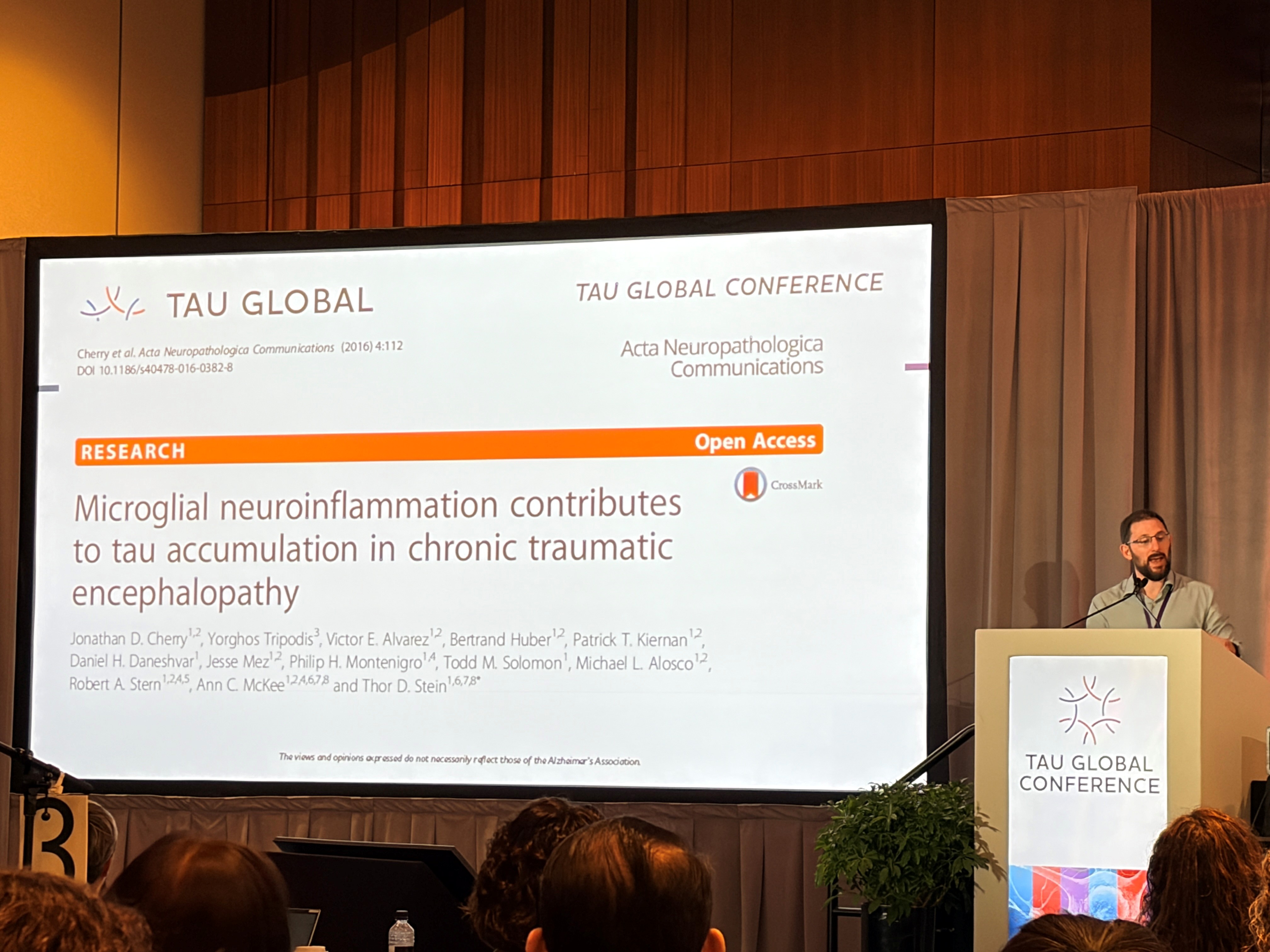 Dr. Cherry speaking at Tau Global 2026